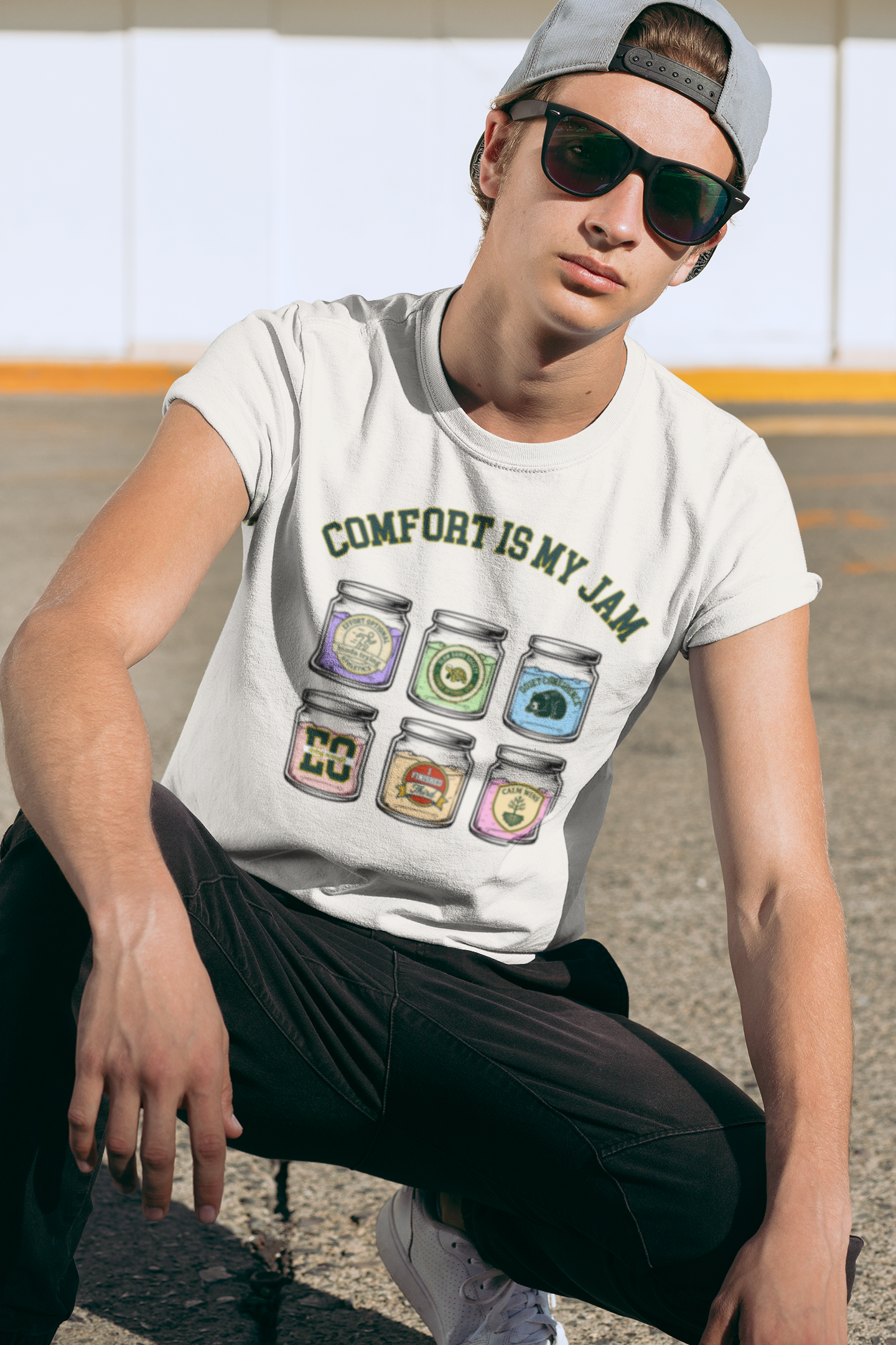 Person wearing a t-shirt with 'Comfort is My Jam' graphic design outdoors.