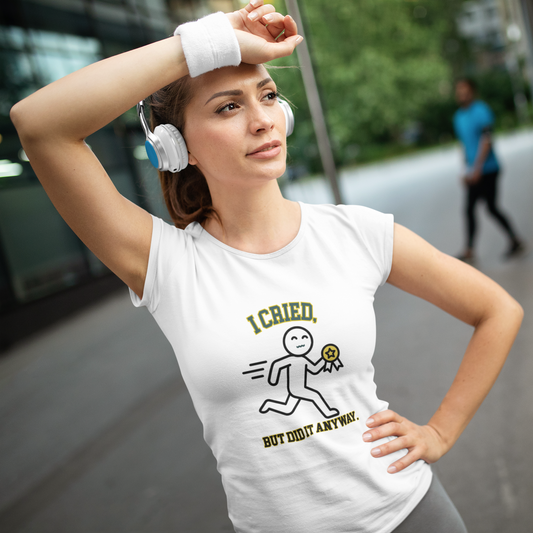 Woman wearing a white t-shirt with a humorous graphic and text, outdoors.