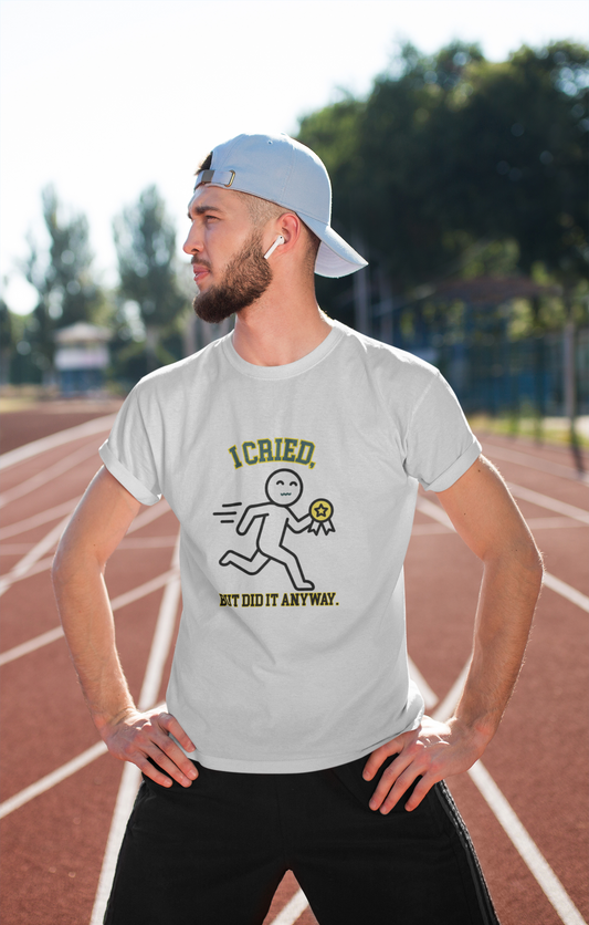 Man wearing a white t-shirt with a graphic design on a running track