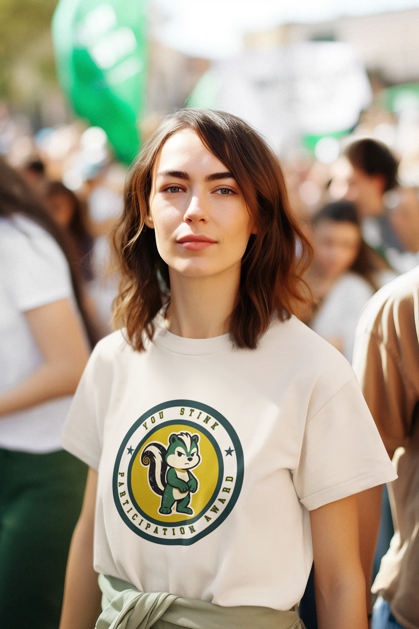 Woman wearing a white t-shirt with a logo in a crowd