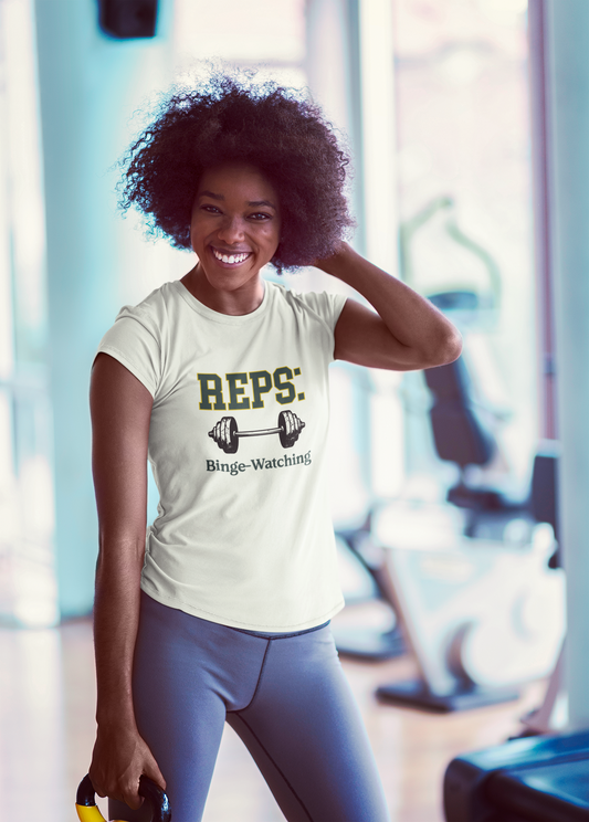 Woman in a gym wearing a t-shirt with 'REPS: Binge-Watching' text.