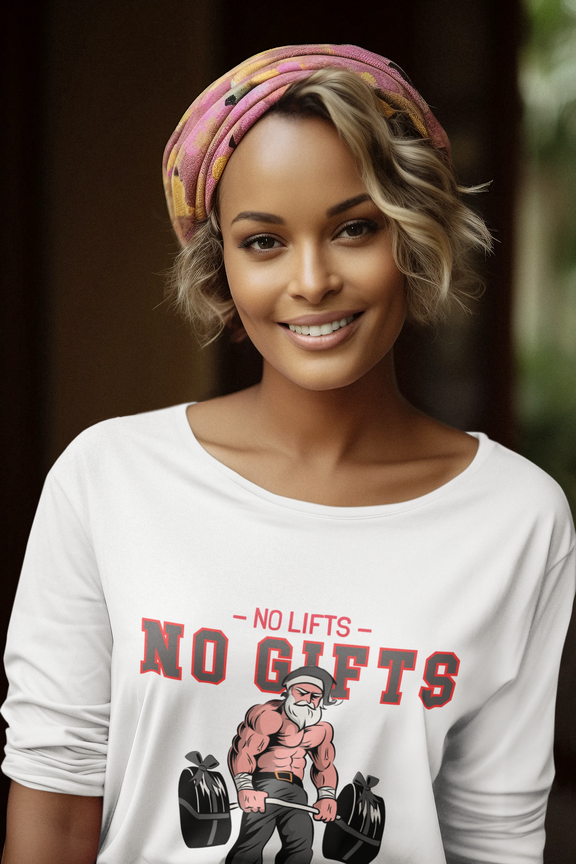 Woman wearing a white t-shirt with a graphic and text, smiling against a blurred background