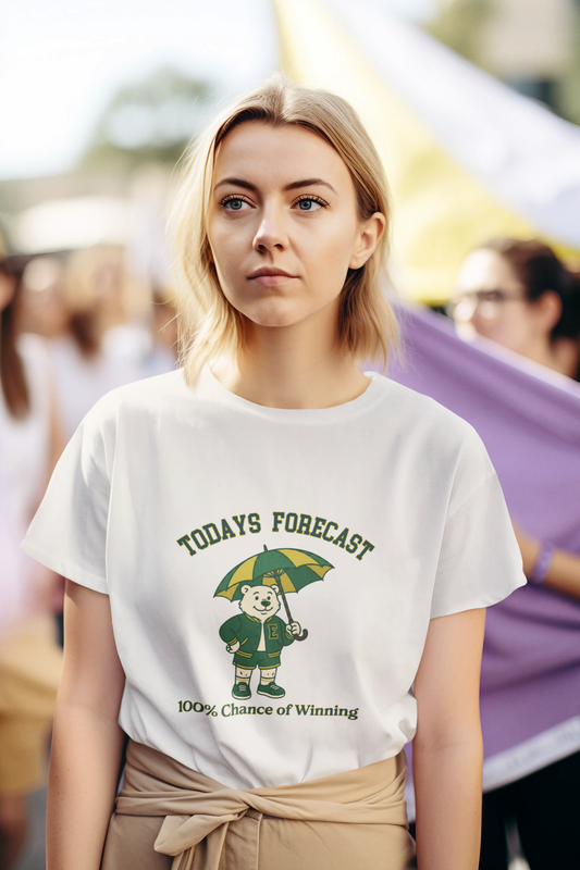 Woman wearing a white t-shirt with a graphic design and text, standing in a crowd.