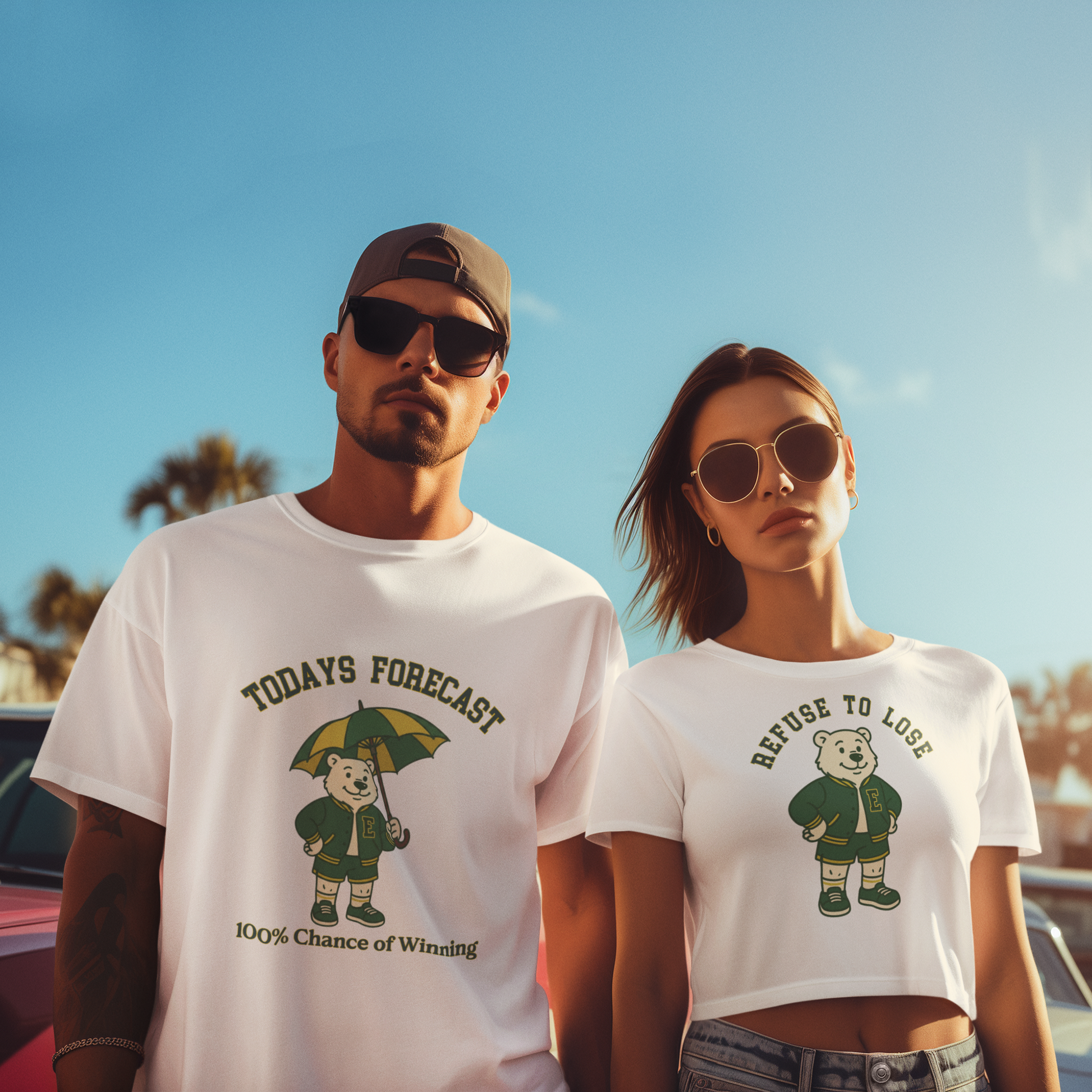 Two people wearing matching t-shirts with bear graphics and text against a clear blue sky.