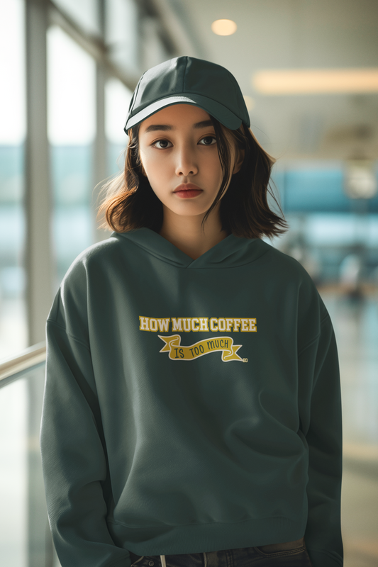Person wearing a green hoodie with text and cap indoors