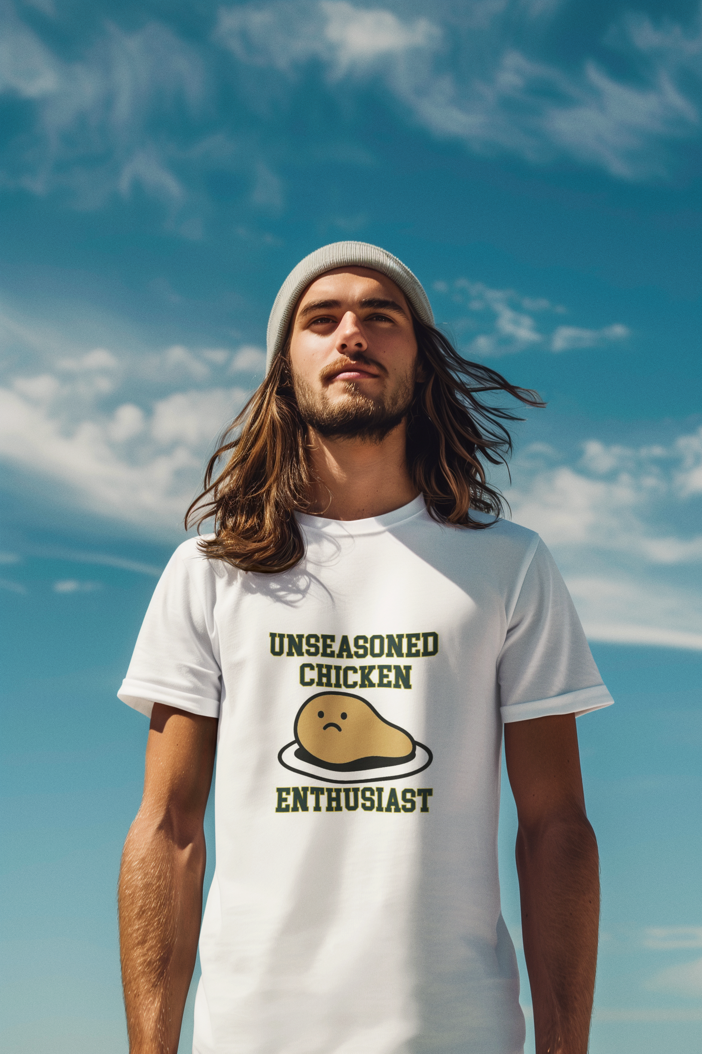 Man wearing a white t-shirt with 'Unseasoned Chicken Enthusiast' graphic against a blue sky.