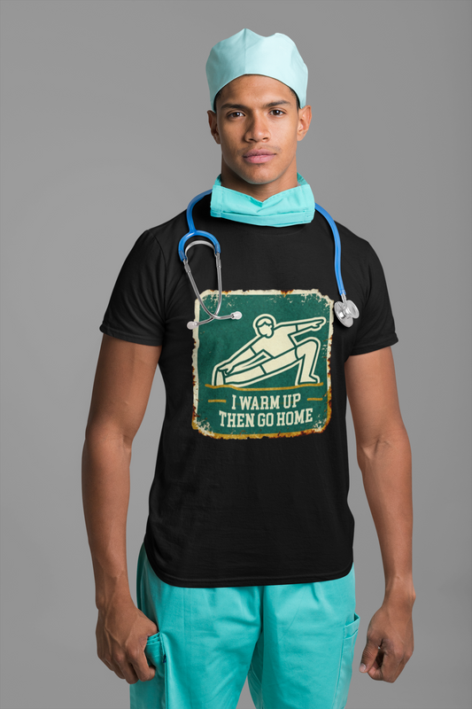 Person wearing a black t-shirt with a graphic design and teal scrubs on a gray background